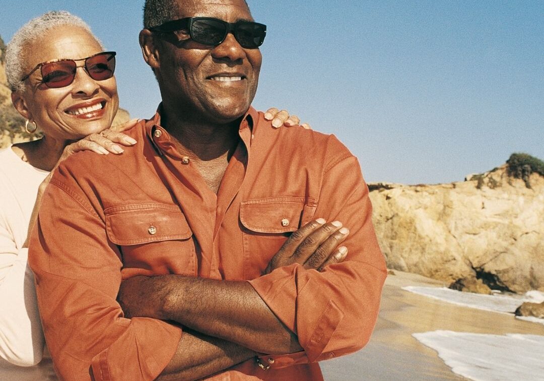 senior couple enjoying the beach